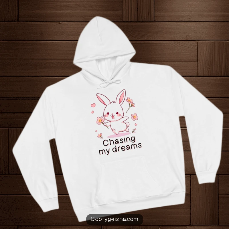 Funny hoodie depicting a joyful rabbit mid-chase with a floating blossom, perfect for cozy and humorous lounging.