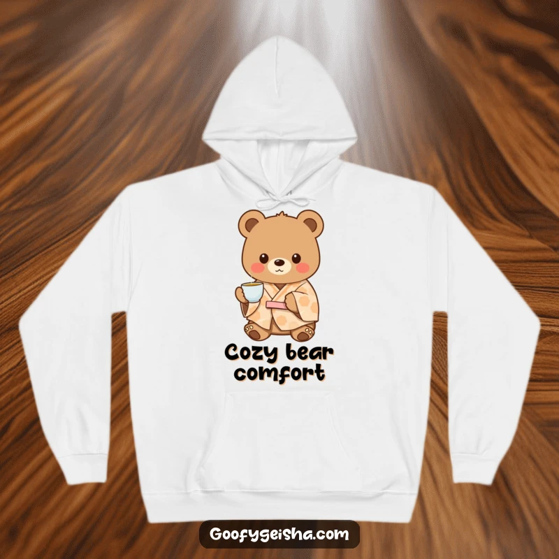 Funny charming bear in a patterned kimono, offering tea, depicted on a warm and cozy hoodie.