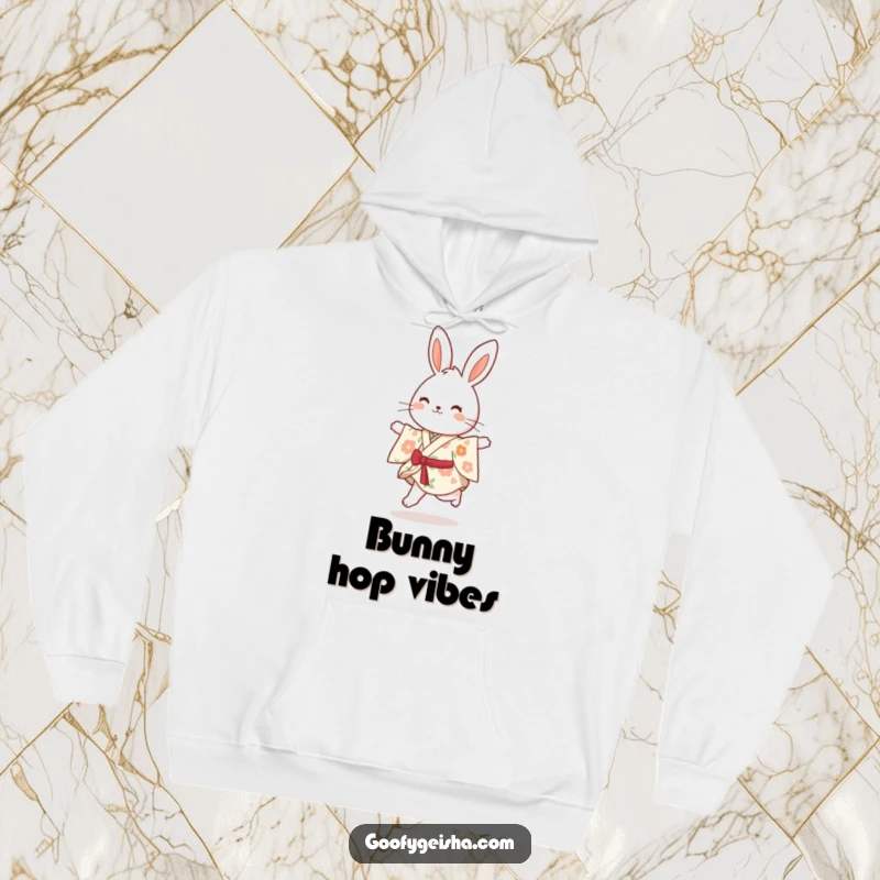 Funny bouncy bunny in a floral kimono, joyfully skipping, depicted on a warm and cozy hoodie.