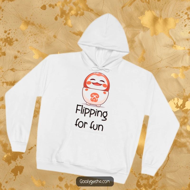Funny hoodie showing a cute Daruma doll character balancing on its head with a wide, happy smile.