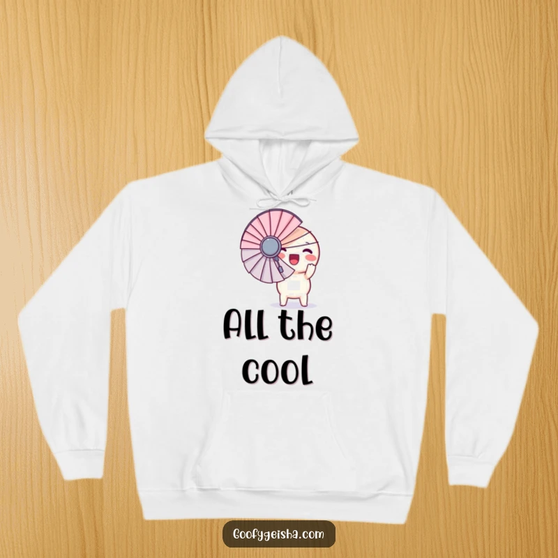 Funny hoodie featuring a round Kawaii character excitedly clutching a giant fan, offering cozy comfort and a burst of humorous cheer.