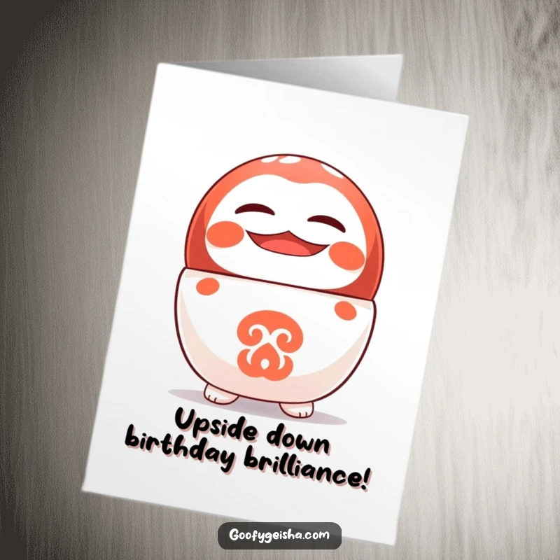 Funny Free Printable Birthday Card: A cute Daruma doll character stands upside down on its head with a wide, cheerful grin. Downloadable fun!