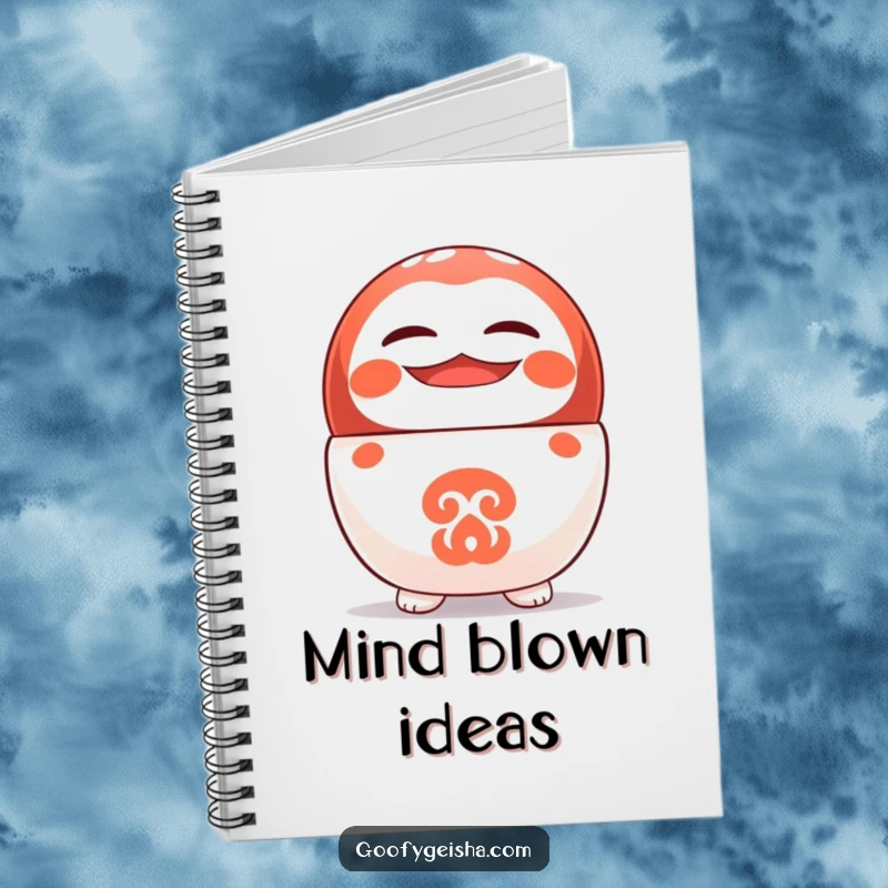 Funny notebook with a cute Daruma doll character balancing on its head with a big grin, ideal for notes.